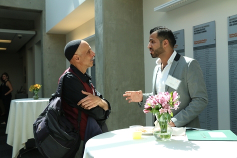USF Professor Andrew Ramer discusses interreligious relations with an attendee during the lunch and prayer session.  Photo courtesy of Racquel Gonzales/Foghorn