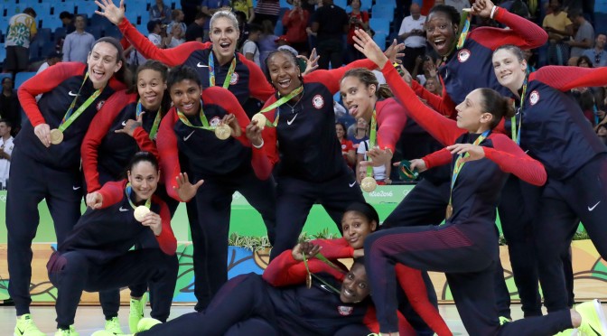 Members of the United States basketball team pose their gold medals after their win over Spain in a women's basketball game at the 2016 Summer Olympics in Rio de Janeiro, Brazil, Saturday, Aug. 20, 2016. (AP Photo/Eric Gay)